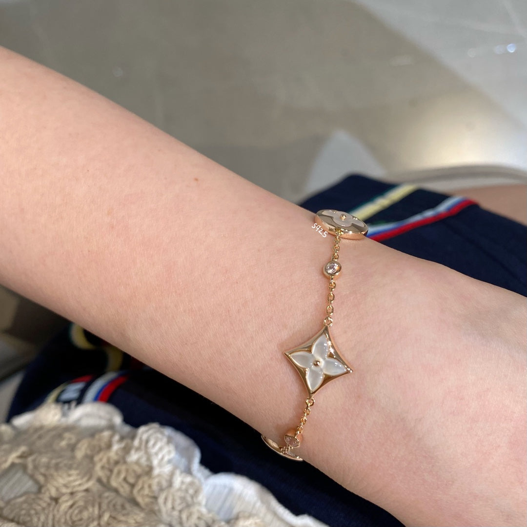 Mysitc STAR AND SUN 4 MOTIF WHITE MOP PINK GOLD BRACELET