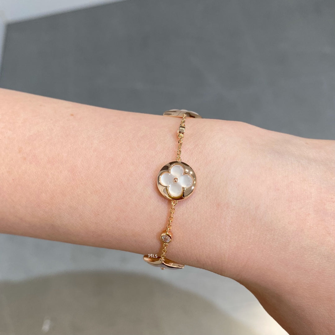Mysitc STAR AND SUN 4 MOTIF WHITE MOP PINK GOLD BRACELET
