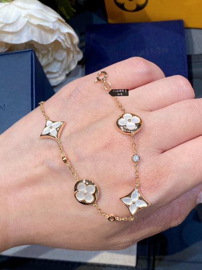 Mysitc STAR AND SUN 4 MOTIF WHITE MOP PINK GOLD BRACELET